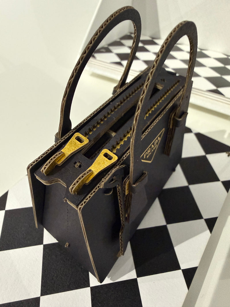Miniature papercraft sculpture of the iconic Prada Galleria Bag