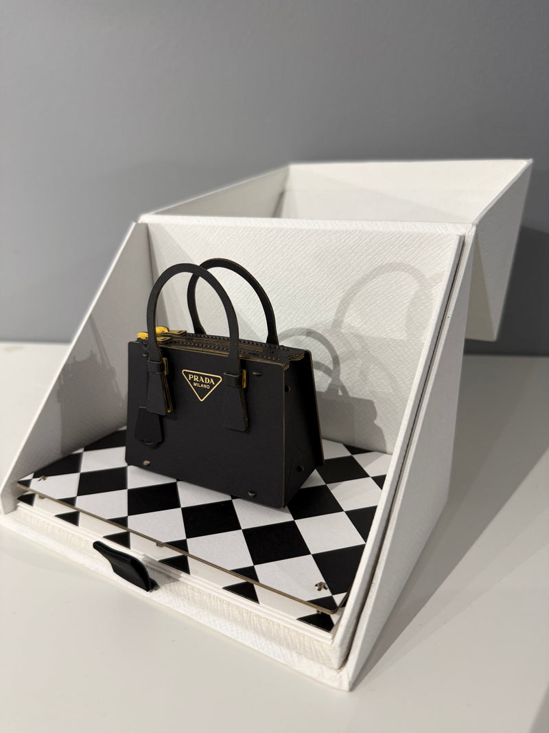 Miniature papercraft sculpture of the iconic Prada Galleria Bag